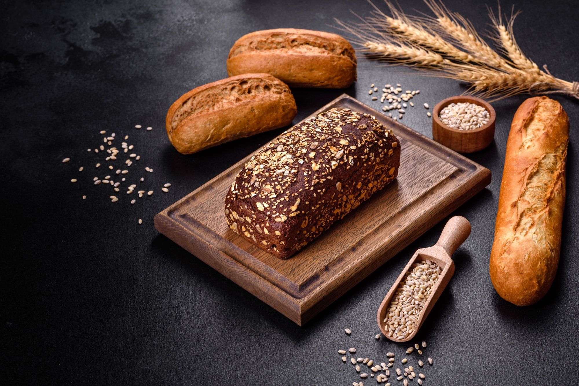 fresh bread on black background top view copy space.jpg